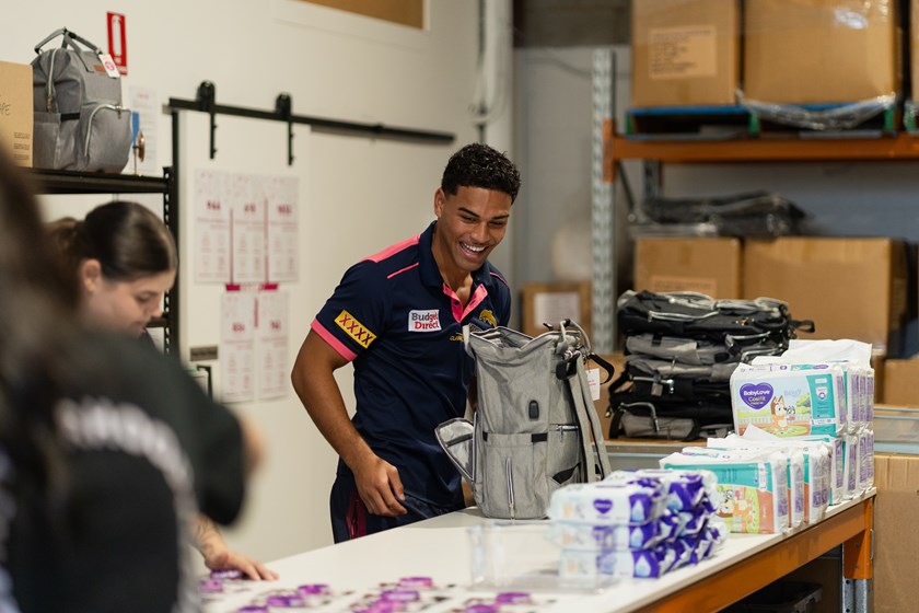 Tevita Naufahu helping pack baby buddles at A Brave Life